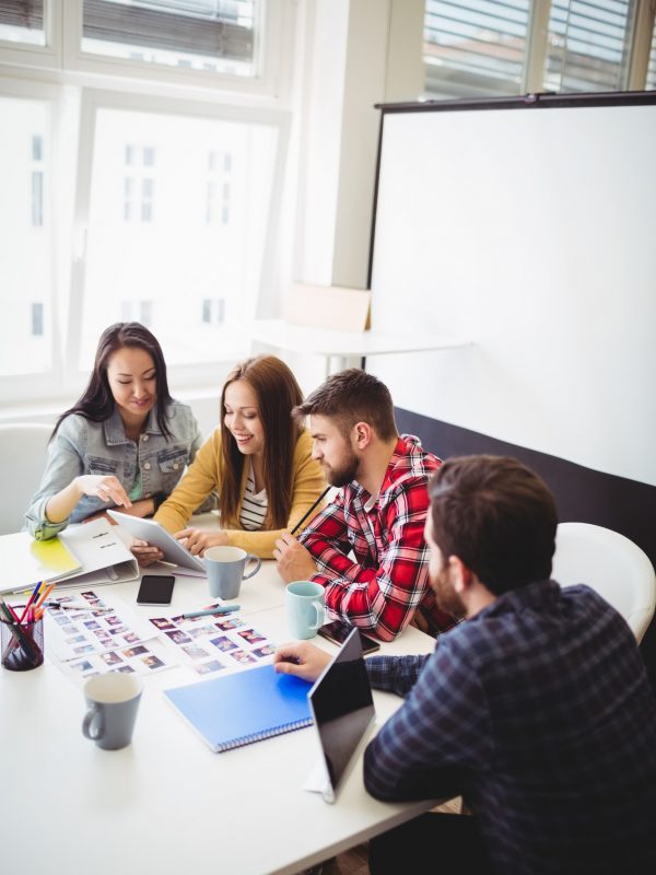 photo-editors-with-digital-tablet-in-meeting-room.jpg